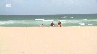Ahead of Hurricane Isaias' impacts, beach goers in Stuart soak up sunshine