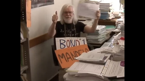 CERN “Happy” Video - at the 2:31 Mark - Man Holds MANDELA Sign - Coincidence?