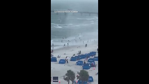 usa footage capture water spout ripping through crowded beach
