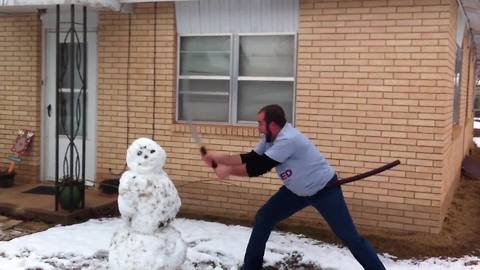 "Man Cuts Snowman in Half With a Samurai Sword"