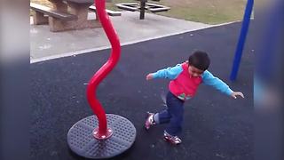 Cute Tot Boy Gets Dizzy After Spinning On A Roundabout