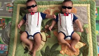 "Twin Baby Boys Dance With Sunglasses On"