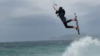 Kitesurfer pulls off amazing jump during storm