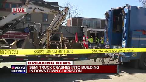 Driver hurt as semi truck crashes into dental office in downtown Clarkston