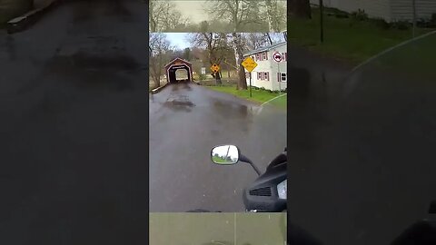 Motorcycle ride through covered bridge. Did a police car really pull a boat over?