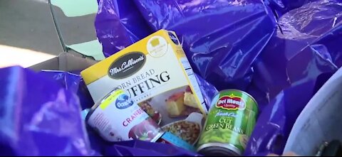 One councilwoman helps hand out food to families in need