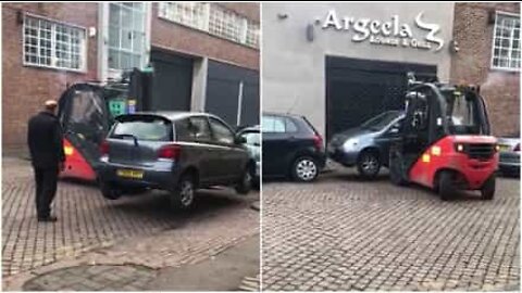 Forklift tows car in a very strange way