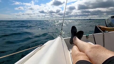 Sailing Lake Ontario, 1-2 meter rollers, light chop, 12-15 kts wind.