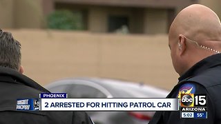 Driver, passenger in custody after ramming Phoenix police patrol car