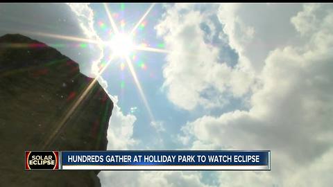 People gathered at Holliday Park to watch eclipse