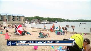 Locals enjoy warm weather at the beach