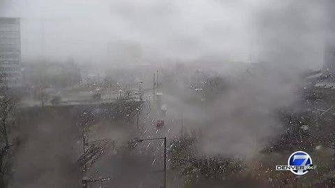 Snow falls in downtown Denver as storm moves through Colorado