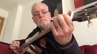 Playing a classical guitar with a reesha or oud pick 7