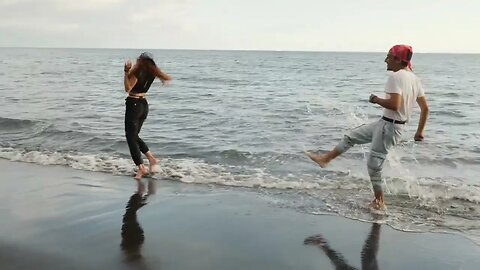 Couple Having Fun At The Beach