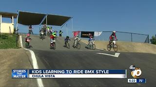 Kids learning to ride BMX-style