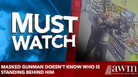 Masked gunman doesn’t know who is standing behind him