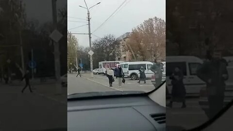 The central street in Kherson, people greet the military with the anthem playing