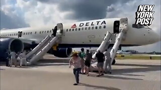 Dramatic video captures Delta passengers evacuating on slides after fiery tire blowout