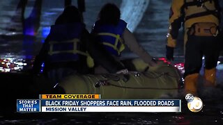 Shoppers rescued after driver gets stuck in flooded street