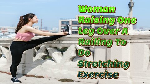 Woman Raising One Leg Over A Railing To Do Stretching Exercise