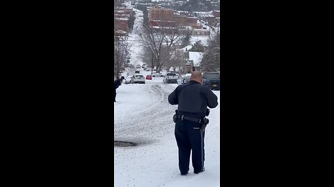 Cop Accidentally Causes Parked Cars to Slip On Icy Hill