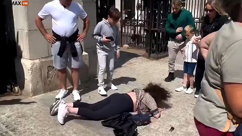 Woman Stands Too Close To The Kings Guard, Gets Nudged By The Horse, Faceplants Hard