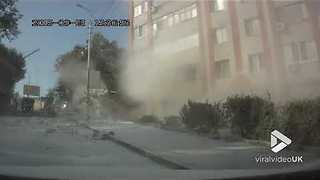 Truck carrying flour crashes into an apartment building