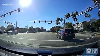 Video catches driver creeping through intersection, running red light