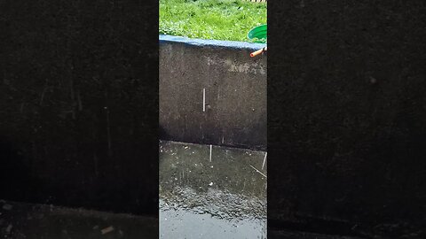 The sound of rain hitting concrete