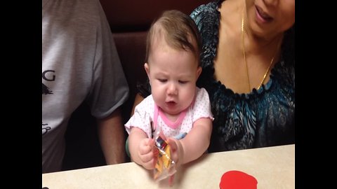Baby has Epic Battle with Cookie Wrapper