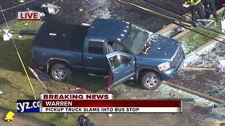 Pickup truck slams into Warren bus stop