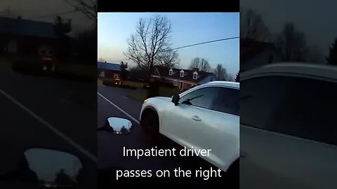 Bad driver passes motorcycle on right, doesn't care