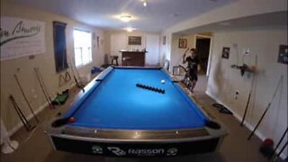 Pool player right on cue with awesome trick shots