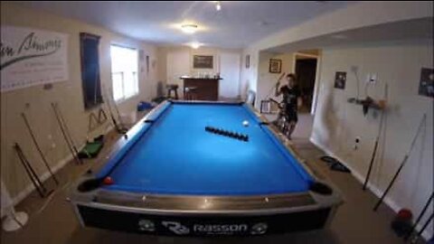 Pool player right on cue with awesome trick shots