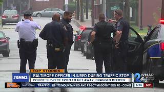 Baltimore officer injured after being dragged by car