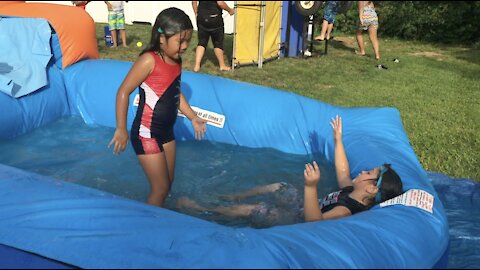 Slip and Slide Water Sliding Fun Challenge at Summer Birthday Party pre-Covid19