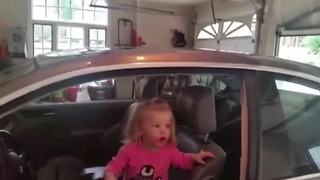 "Litlle Girl Amazed By Garage Door"