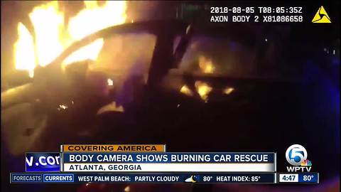 Police body cam shows Atlanta officer rescue driver from burning car