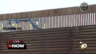 Crews heighten border fence in San Ysidro