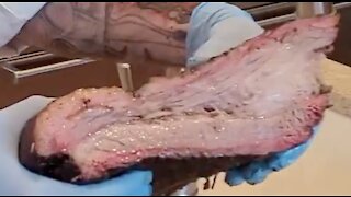 The Semper Fi Chef Cutting into a brisket!