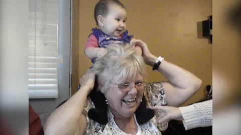 "Baby Sits On Granny’s Shoulders"