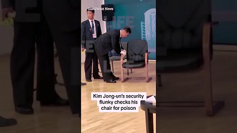 Kim Jong-un's security flunky checks his chair for poison