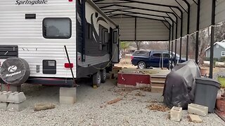 We moved the camper under a cover