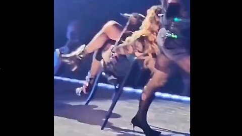 Madonna Wipes Out While Her Chair Is Being Pulled By Her Dancer