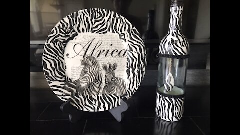 Plate and bottle decorated with African scene