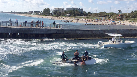 5 people rescued after boat overturns at Boynton Inlet