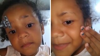 Little girl records herself shaving off an eyebrow