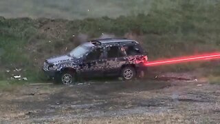 American multi-barreled M134 machine gun fires tracer ammunition during a test