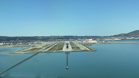 Flight deck view approach and landing at San Francisco (KSFO) airport runway 28R March 2021.