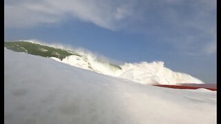 Raw pov Wave holds surfer underwater in violent turbulence